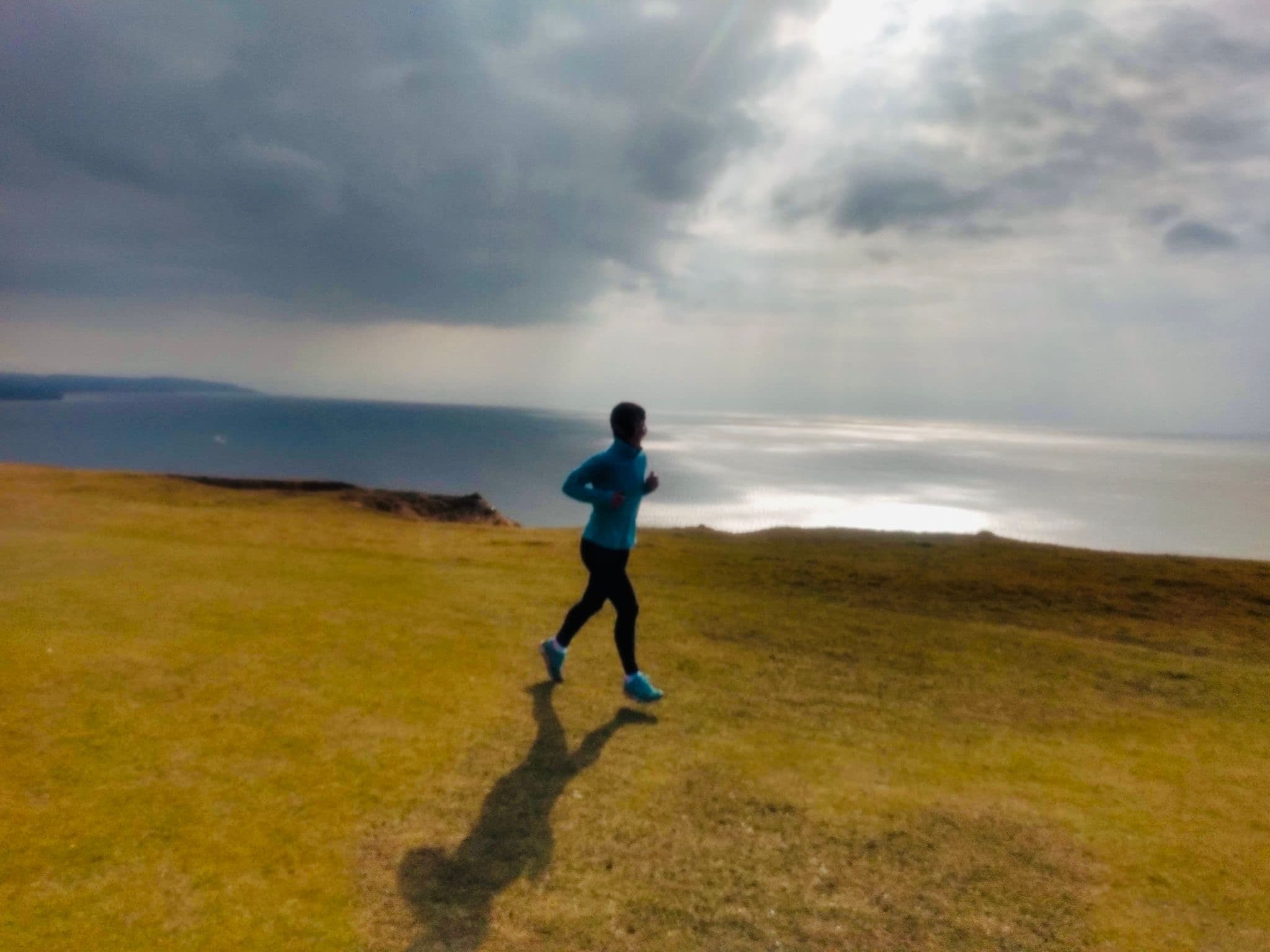 Amanda Brookfield running on the clifftops